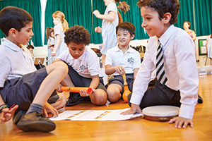 Students playing music in the classroom