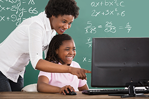 Girl & Teacher - Ofsted’s new Vision: Benchmarking your MATs performance