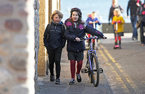 Two children cycling