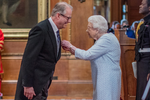 Nigel getting his OBE from the Queen