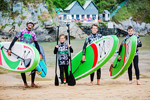 Group of children at their customised activity week on a private Cornish Beach