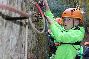 Boy climbing at Beaudesert Outdoor Activity Centre