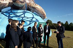 Pupils and teachers at St Clement Danes School with Chris Bertish and their giant Eco-Turtle blimp celebrating recycling week