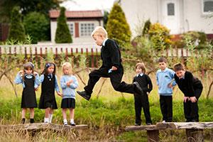 Children playing on school grounds - Learning Through Landscapes