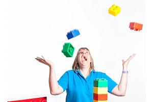 Woman playing with Thera-Build® lego blocks