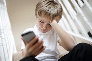 Sad boy on phone - mental health issues