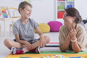 Teacher and student in classroom discussion their mental health and wellbeing