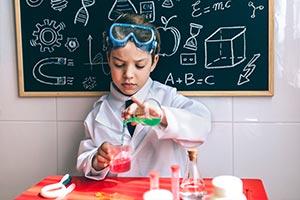 child carrying out science experiment