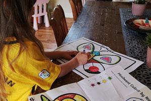 Young girl using Twinkl free learning resources
