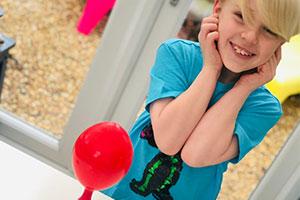 British Science Week - a child with balloon does experiment