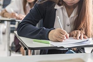 child taking exam - exam cancellation update