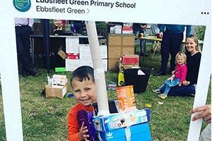 pupil at green primary celebrating signing on funding agreement