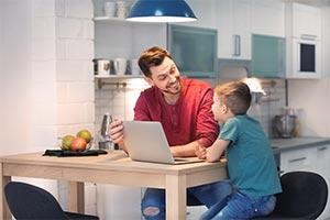 child and parent using virtual tuition