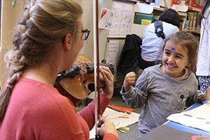 child making music with BCMG awarded grant
