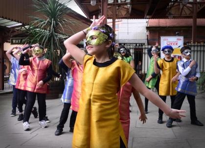 Children performing a Shakespeare inspired dance