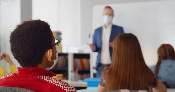 Children and a teacher in a classroom