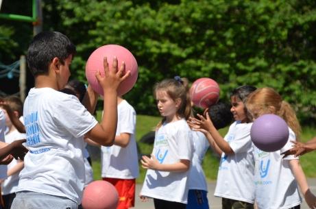 Children playing outside with balls - children's mental health week