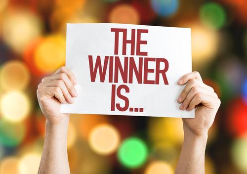 A poster with the text The Winner Is