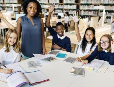 Children learning with a teacher