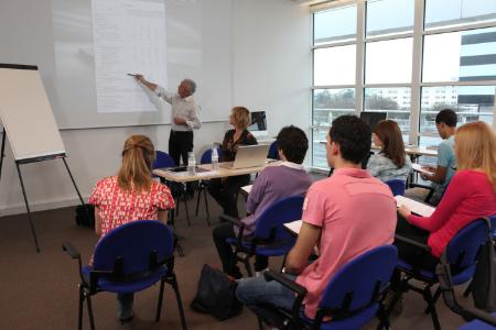 A classroom of adults being taught