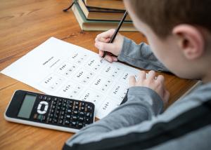 A boy doing an SAT math test
