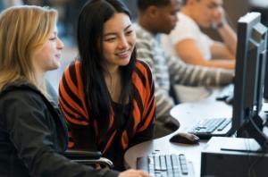 Two females working at a computer