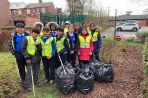 Children with bags of litter they have collected
